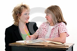 Student and Teacher at Desk