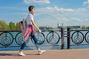 Student teen girl portrait with backpack outdoor in street smiling happy going back to school, copy space