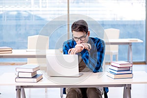 Student in telelearning distance learning concept reading in lib