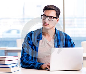 Student in telelearning distance learning concept reading in lib