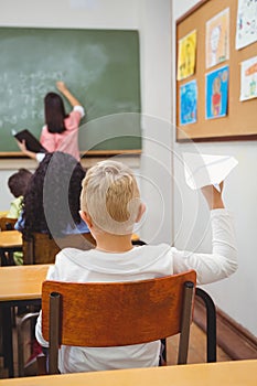 Student about to throw a paper airplane