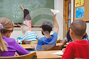 Student about to throw a paper airplane