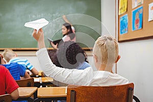 Student about to throw a paper airplane