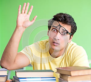 Student with too many books to read before exam