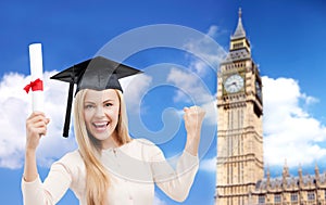 Student in trencher cap with diploma over big ben