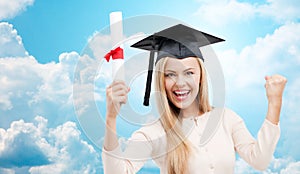 Student in trencher cap with diploma over blue sky