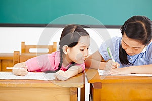 student trying to cheat at test in class photo