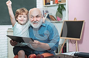 Student and tutoring education concept. Thank You Teacher. Little ready to study. Grandfather and grandchild. Portrait