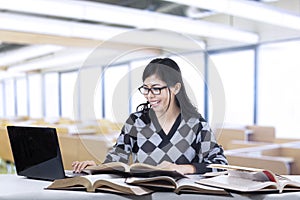 Student typing the source book 2