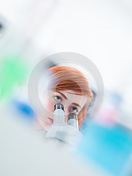 Student under microscope analysis