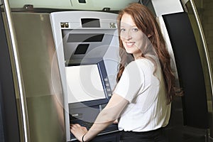Student using a ATM machine at school