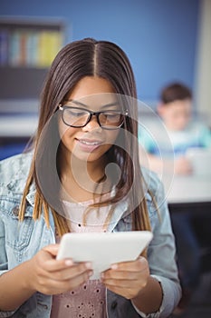 Student using digital tablet in classroom