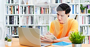 Student using laptop at home