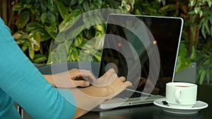 Student using laptop outside on campus