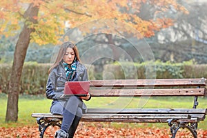 Student using laptop to learning outdoors