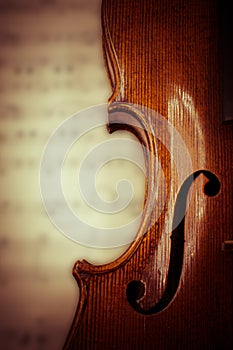 Student Violin Closeup over blurred sheet music