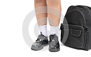 Student wear a black leather shoes and school bag