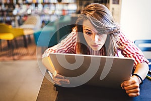 Student woman finding it difficult at study and comprehend scool tasks photo