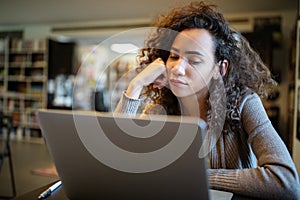 Student woman finding it difficult at study and comprehend scool tasks