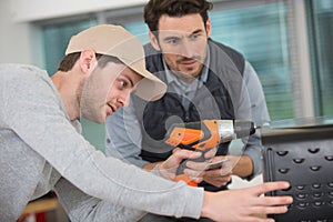 student woodworking class learning to drill with nails