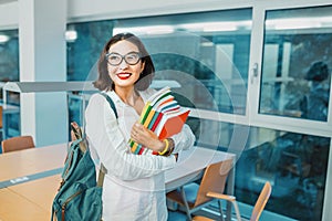 Student with work books in the classroom for lectures at the University. Concept of teaching and learning