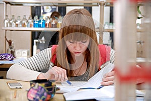 A student at work in laboratory of chemistry studies the records