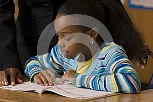 Student works in workbook during school