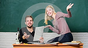 Students in classroom chalkboard background. Education concept. ertificate proves successfully passed university