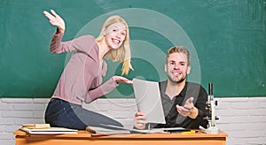 Students in classroom chalkboard background. Education concept. ertificate proves successfully passed university photo