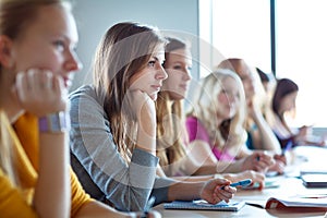 Students in classroom - young pretty female college student