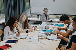 Students collaborating on a group project in a modern classroom