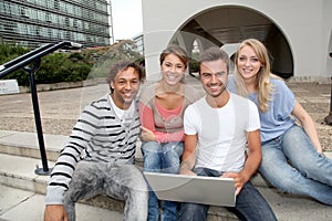 Students in college with computer
