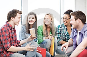 Students communicating and laughing at school photo