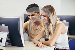 Students in a computer lab, using computers during class