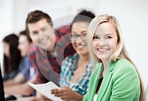 Students with computer studying at school