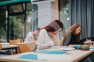 Focused students studying in a modern classroom environment