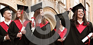 Students with diplomas near campus. Banner design