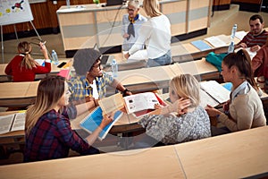 Students discussing while having lecture