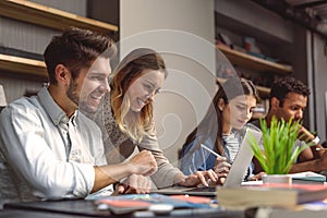 Students doing group project in campus library