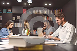 Students doing group project in campus library