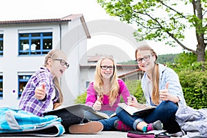 Students doing homework for school together