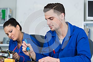 students in electronics class at university