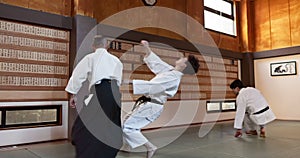 Students, fight and sensei for aikido training, fitness and development with action, exercise and coaching. Teaching