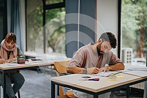 Students focused on studying in a modern classroom setting