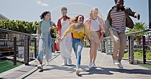 Students, friends and happy with jump at university with freedom, diversity and outdoor on path at campus. Gen z people
