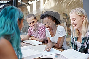 Students, friends and study outdoor at university with books, laptop and learning for education and campus. Group, gen z