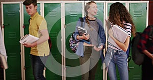 Students, girl and high school locker in portrait for education, learning with talking, fist bump or youth support