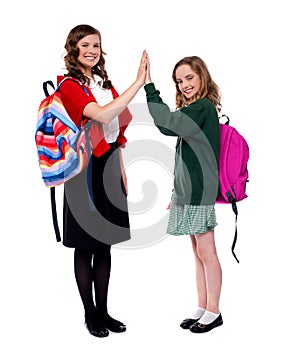 Students giving high five to each other