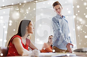 Students gossiping behind classmate back at school