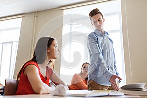 Students gossiping behind classmate back at school